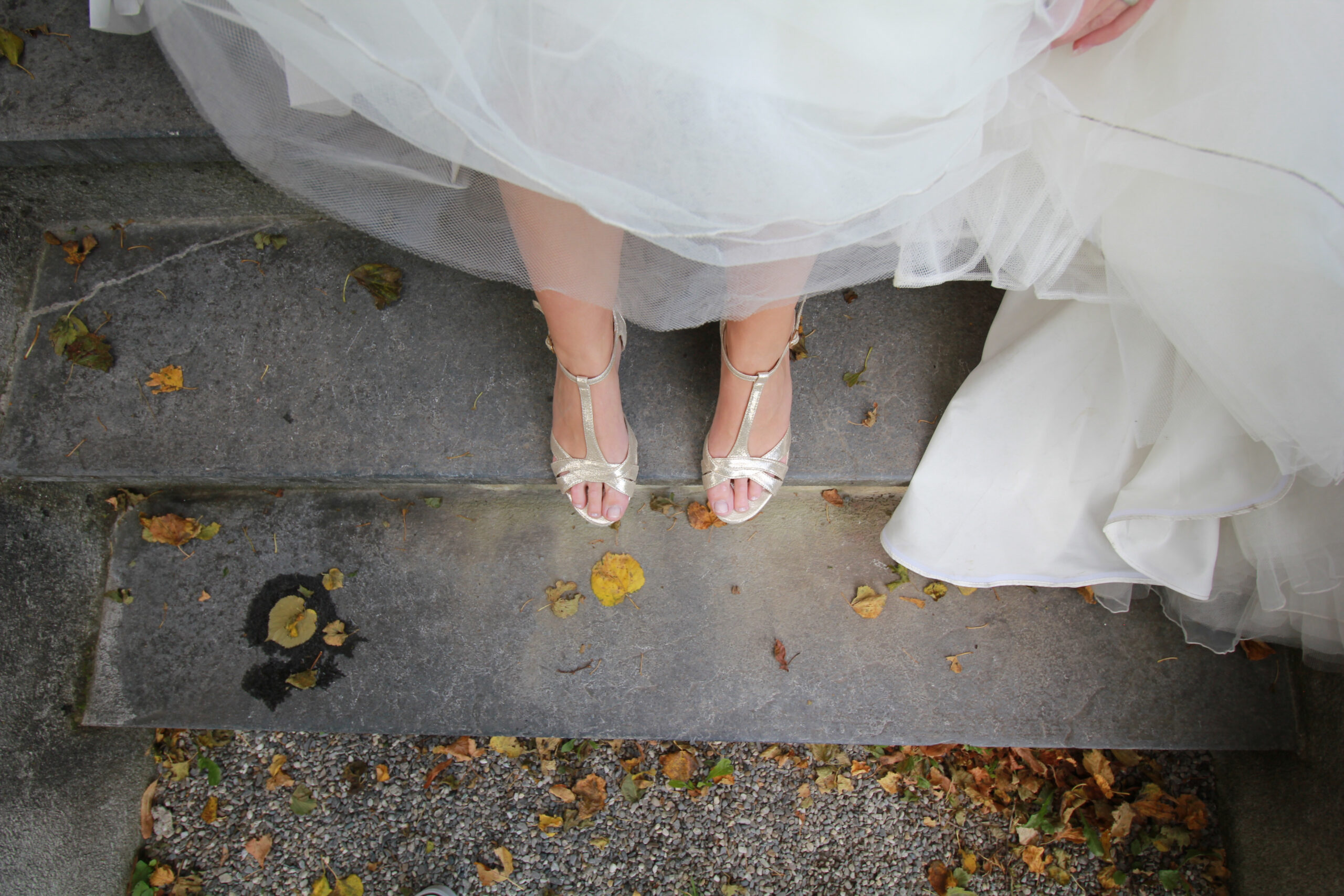 woman in wedding dress with shoes