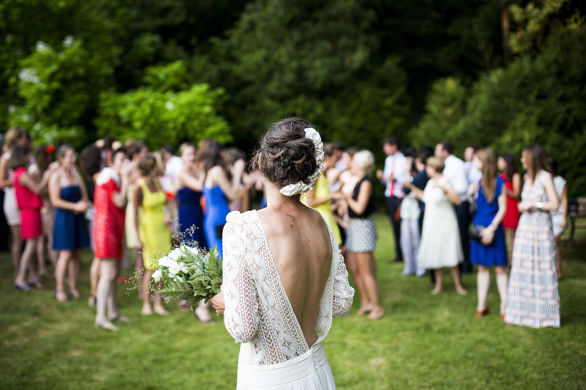 woman tossing flowers wedding