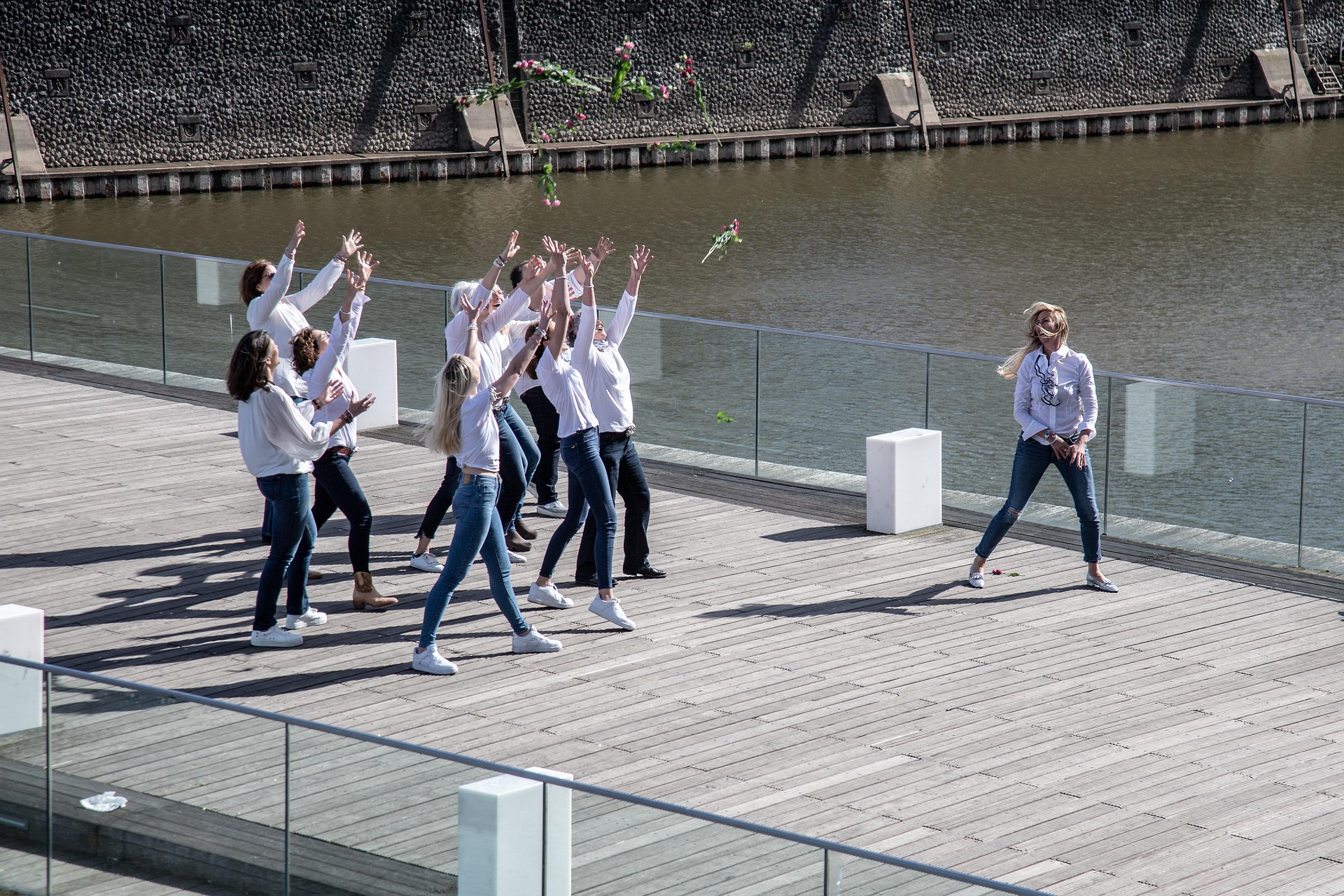 group of women throwing flowers