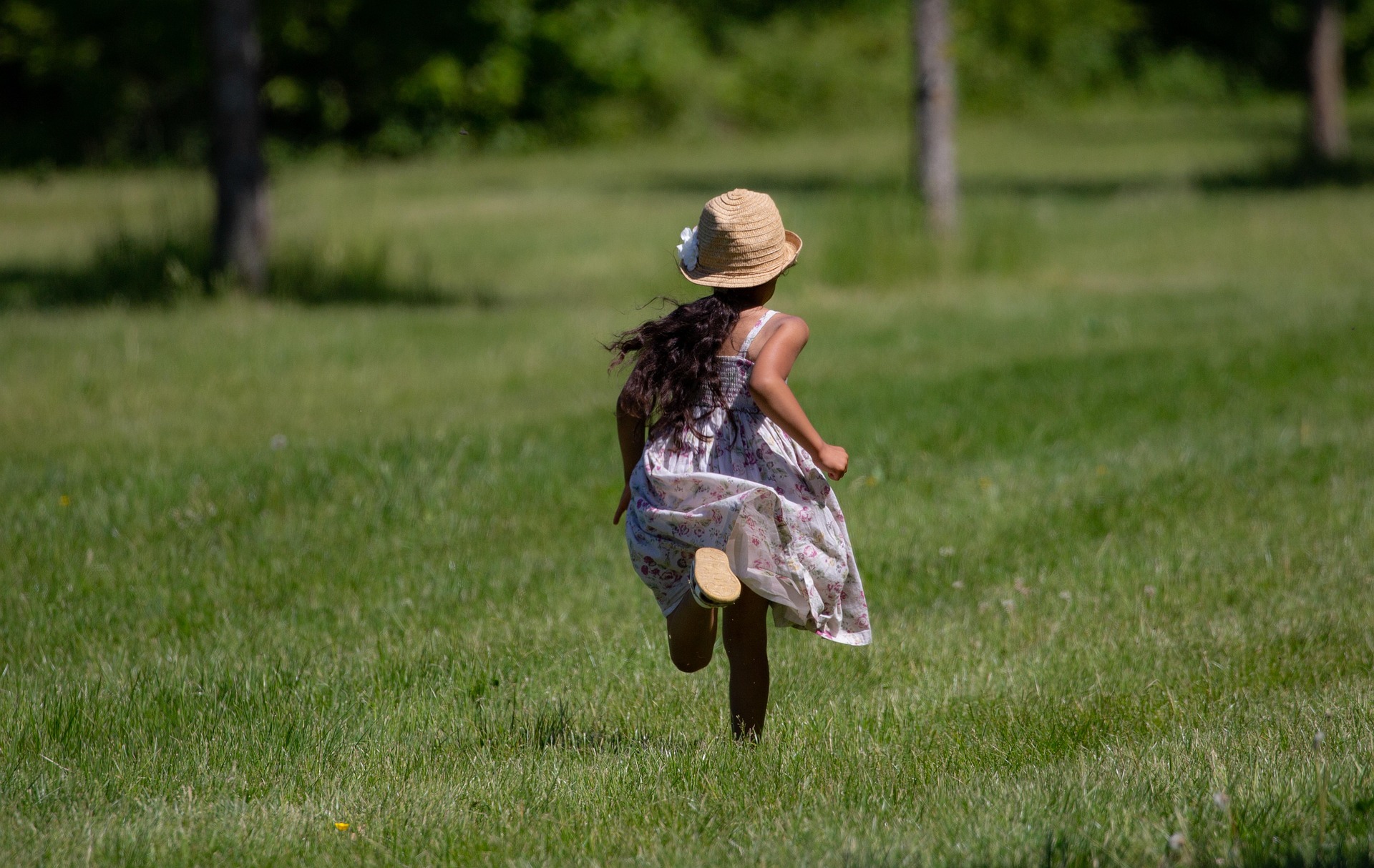 young girl running in field