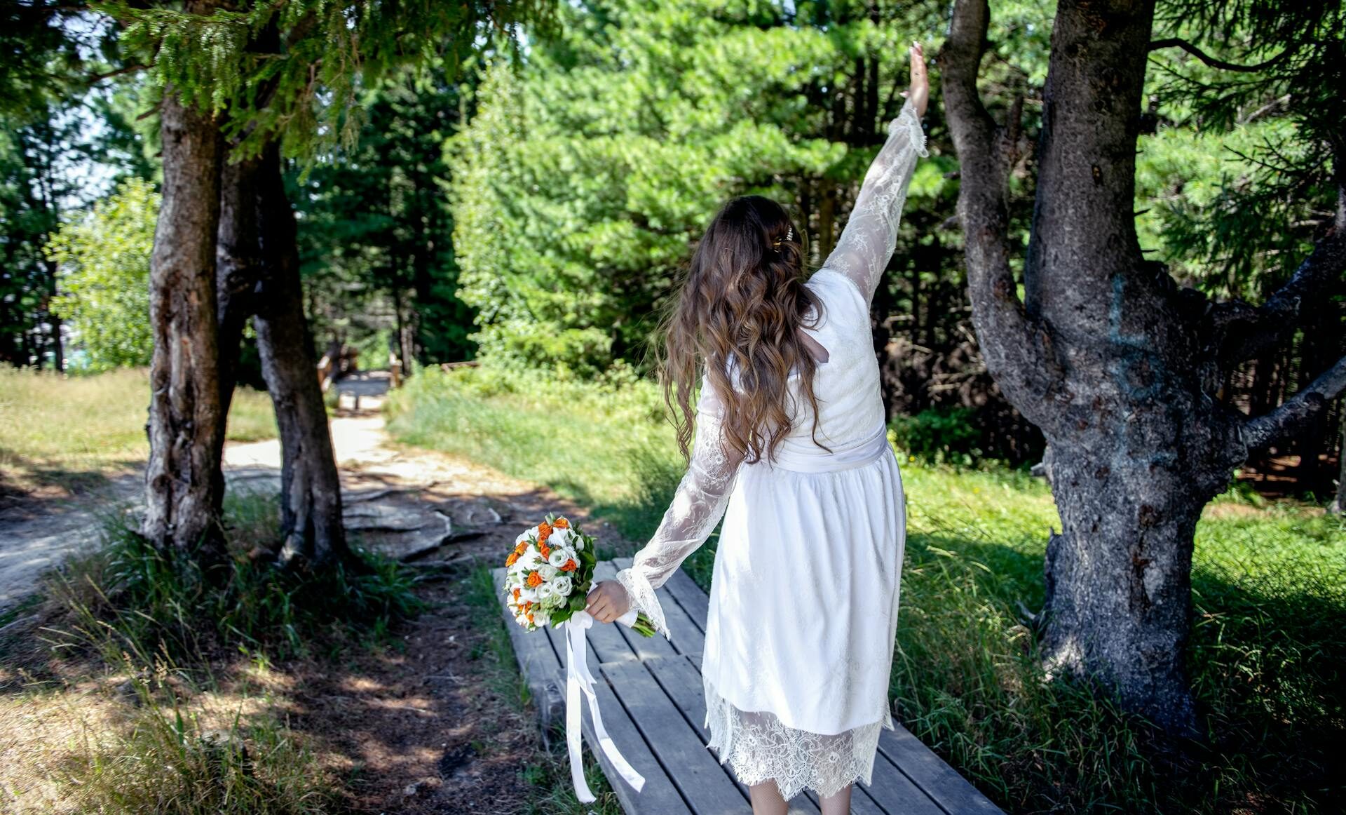 woman outside holding flowers