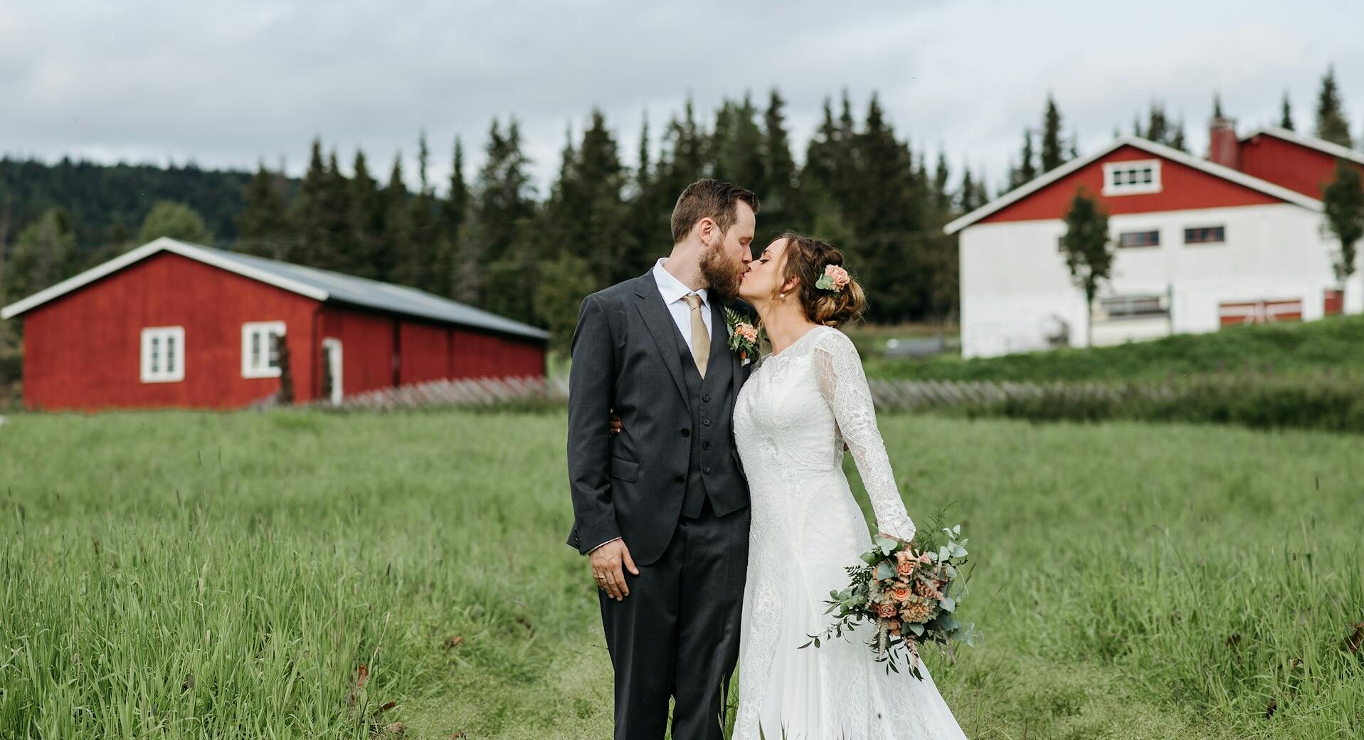 couple kissing farm wedding