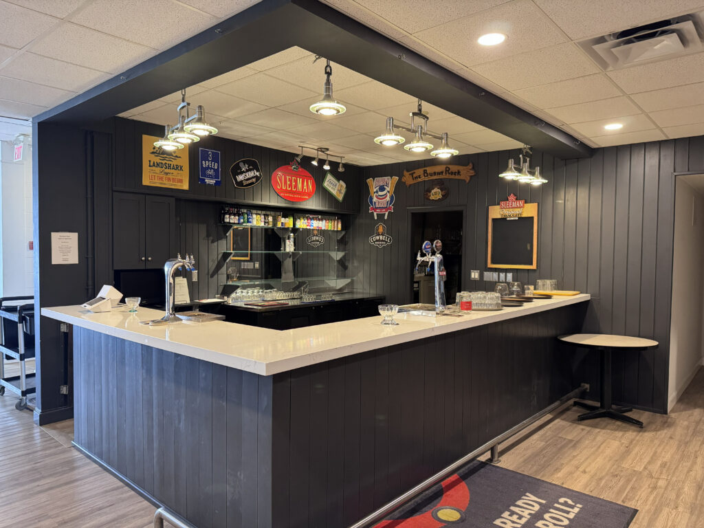 Full bar area at the Barrie Curling Club wedding venue in Barrie Ontario Title: Barrie Curling Club Full Bar — Wedding Reception Venue Barrie