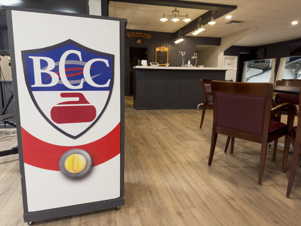 Barrie Curling Club logo and lounge seating area Title: Barrie Curling Club — Venue Identity and Lounge Barrie Ontario