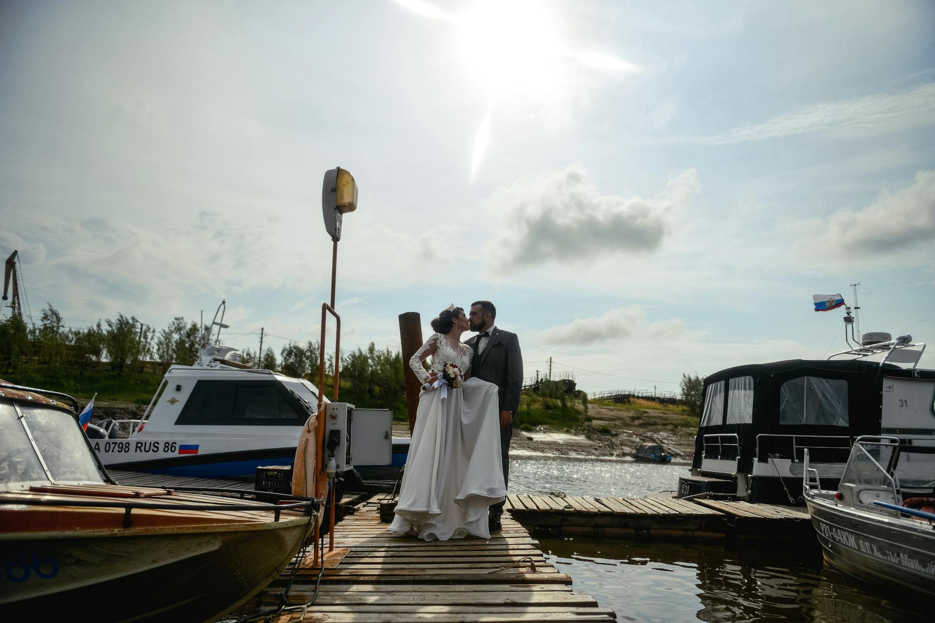 newlyweds waterfront married kissing