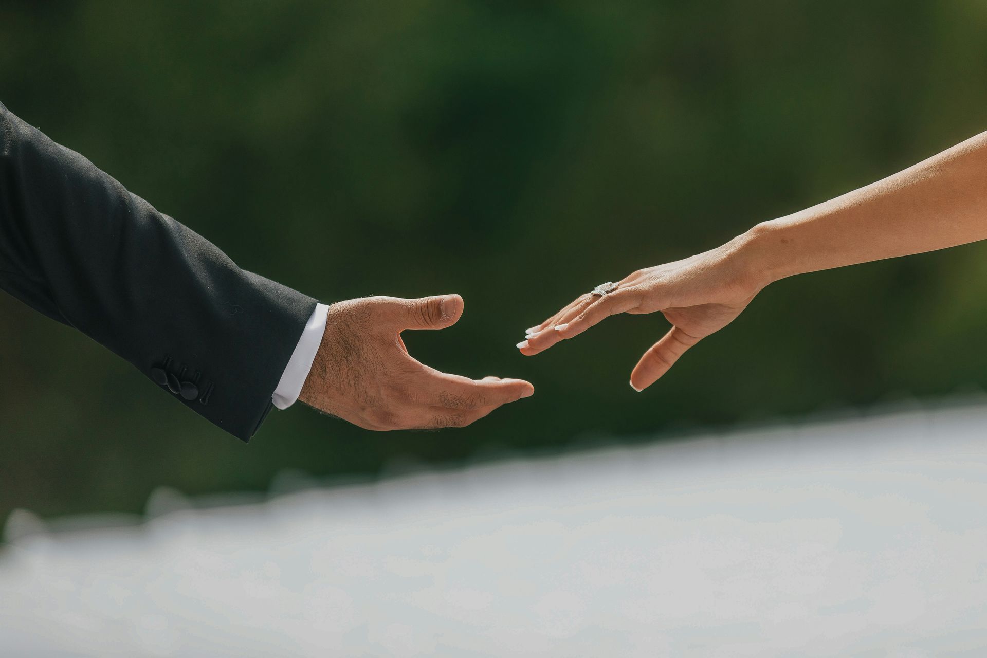 man and woman holding hands married