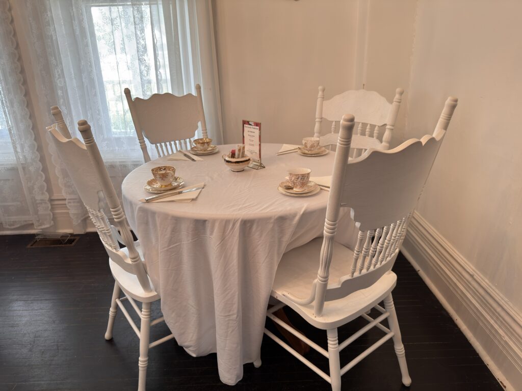 Table setting with The Lovely Teahouse signage