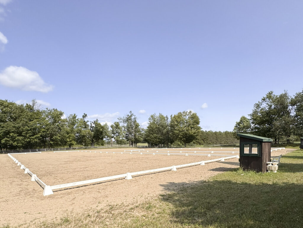 Riding ring and horse jumps at Glen Oro Farm, a working equestrian property